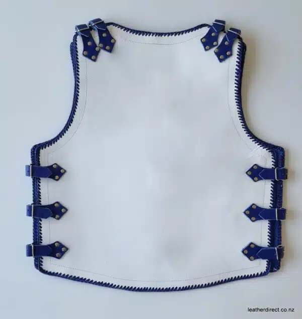 White leather vest with blue straps